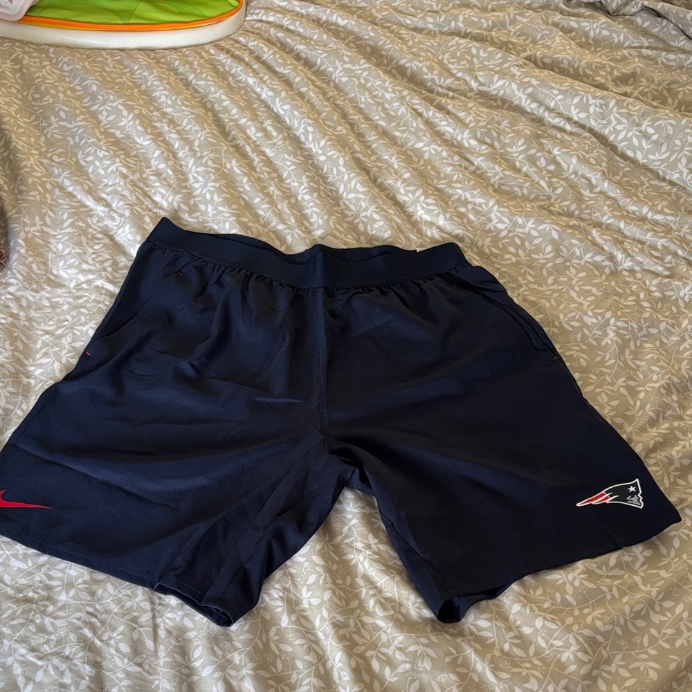 Nike Men's Dark Blue Athletic Shorts with Red Accents
